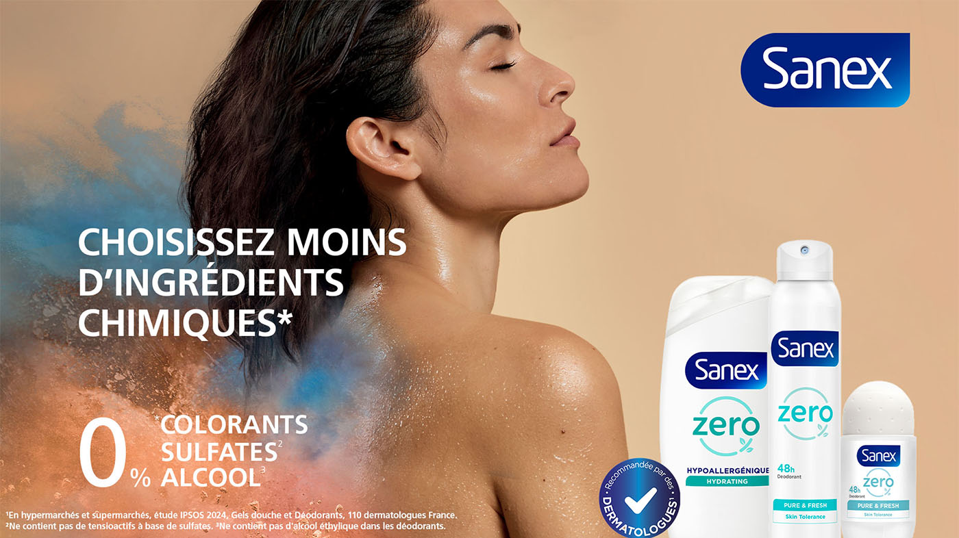 Publicité Sanex Zero%. Une femme de dos, entourée d'un nuage de poudres colorées, avec le texte "Choisissez moins d'ingrédients chimiques". Trois produits de la gamme (gel douche, aérosol, roll-on) sont visibles.